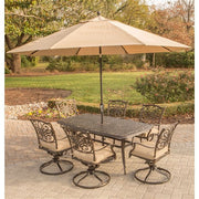 Hanover - Traditions 7pc: 6 Swivel Rockers, 38x72" Cast Table, Umbrella, Base - Tan/Cast-United Backyard
